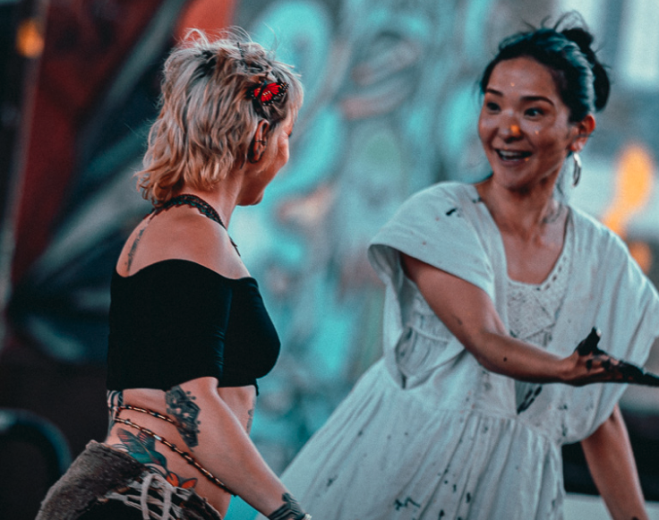 Two people smiling at each other